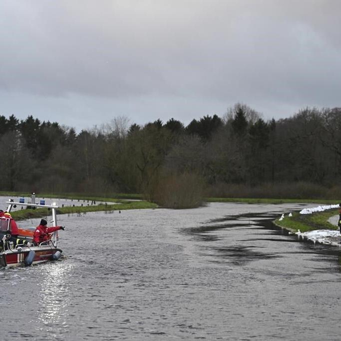 Towns reinforce dikes as heavy rains send rivers over their banks in Germany and the Netherlands